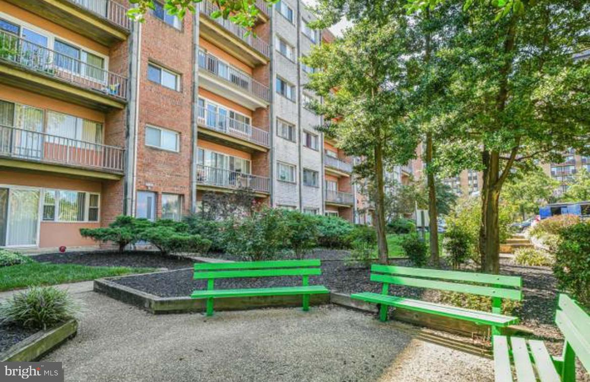 431 North Armistead Street, Unit 502 Alexandria, VA 22312 - Photo 19 of 24 a view of a brick building next to a yard