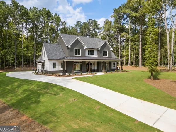 an aerial view of a house with a yard and staircase