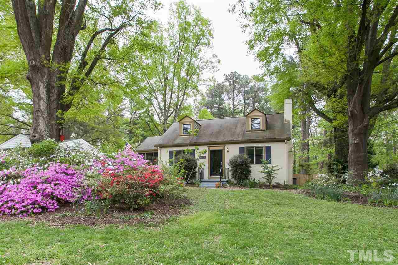 2509 Pickett Road Durham, NC 27705 - Photo 1 of 25 a front view of a house with a garden