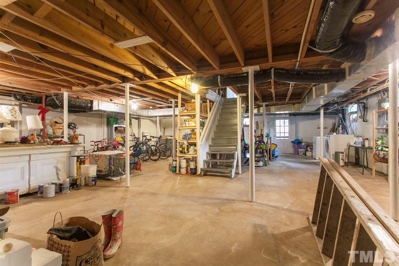 2509 Pickett Road Durham, NC 27705 - Photo 18 of 25 a view of a garage with wooden floor