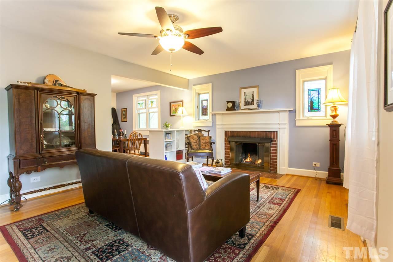 2509 Pickett Road Durham, NC 27705 - Photo 3 of 25 a living room with furniture and a fireplace