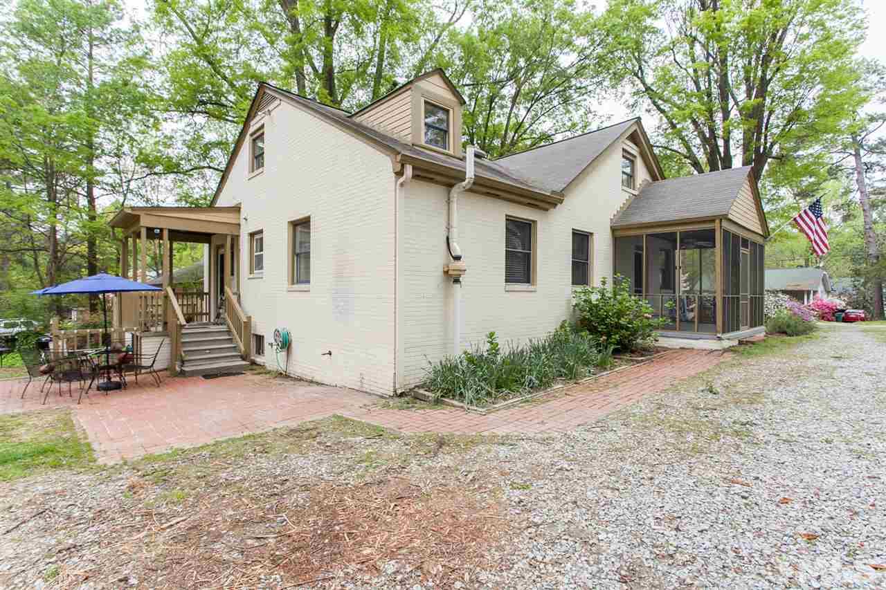 2509 Pickett Road Durham, NC 27705 - Photo 21 of 25 a view of a house with backyard and chairs