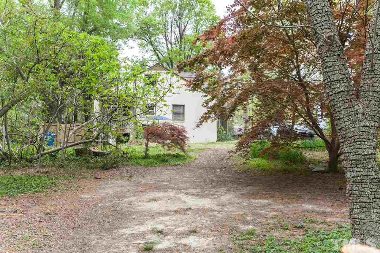 2509 Pickett Road Durham, NC 27705 - Photo 22 of 25 a backyard of a house with lots of green space