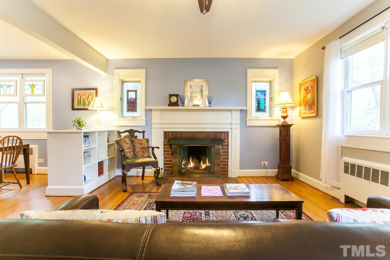 2509 Pickett Road Durham, NC 27705 - Photo 4 of 25 a living room with patio furniture and a fireplace