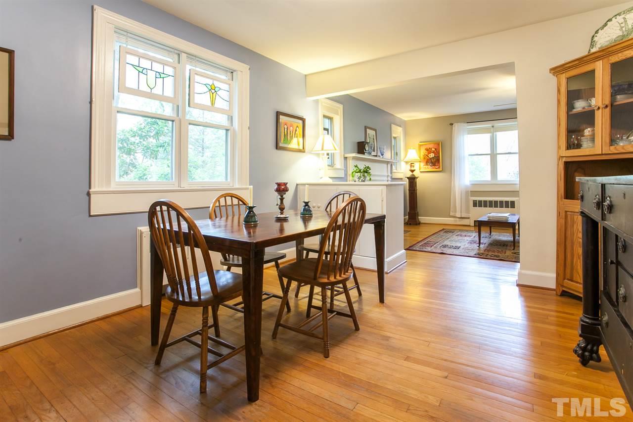 2509 Pickett Road Durham, NC 27705 - Photo 5 of 25 a view of a dining room with furniture and wooden floor