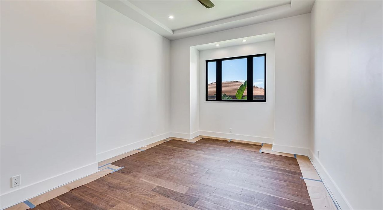 804 Anapuni Loop, Unit 63 Lahaina, HI 96761 - Photo 11 of 30 an empty room with wooden floor and window