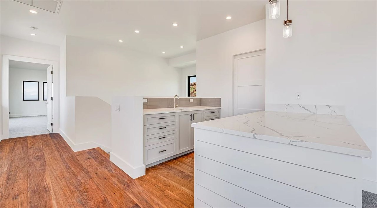 804 Anapuni Loop, Unit 63 Lahaina, HI 96761 - Photo 13 of 30 a bedroom with a bed and a dresser