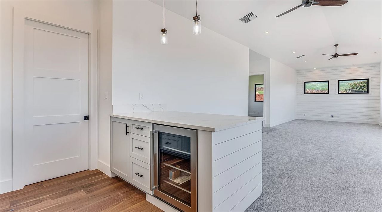 804 Anapuni Loop, Unit 63 Lahaina, HI 96761 - Photo 15 of 30 a view of an empty room with window and wooden floor