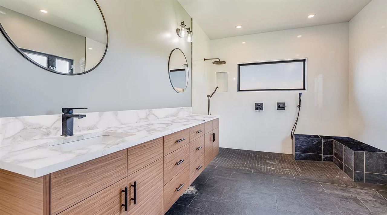 804 Anapuni Loop, Unit 63 Lahaina, HI 96761 - Photo 17 of 30 a bathroom with a sink and a mirror