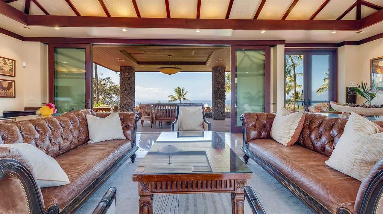 804 Anapuni Loop, Unit 63 Lahaina, HI 96761 - Photo 23 of 30 a living room with furniture and a large window