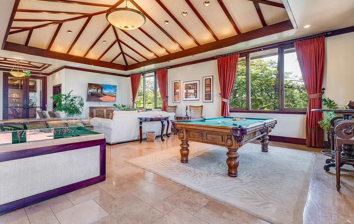 804 Anapuni Loop, Unit 63 Lahaina, HI 96761 - Photo 25 of 30 a living room with patio furniture and a large window