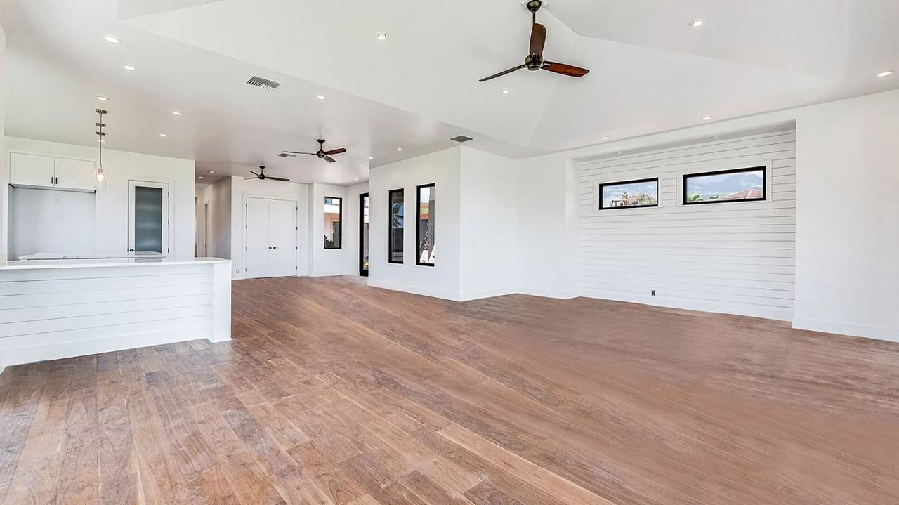 804 Anapuni Loop, Unit 63 Lahaina, HI 96761 - Photo 4 of 30 a view of a big room with wooden floor and windows