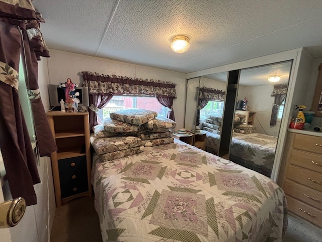 2795 East 28th Road Marseilles, IL 61341 - Photo 12 of 64 a bed room with a bed and a mirror