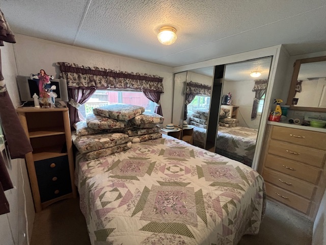 2795 East 28th Road Marseilles, IL 61341 - Photo 13 of 64 a bed room with a bed and a mirror