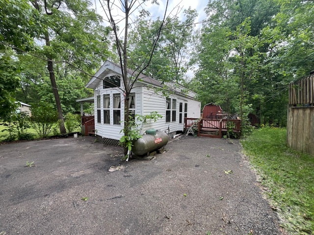 2795 East 28th Road Marseilles, IL 61341 - Photo 2 of 64 a view of a house with a small yard and large trees