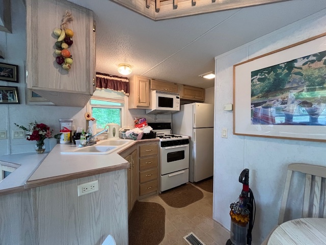 2795 East 28th Road Marseilles, IL 61341 - Photo 10 of 64 a kitchen with stainless steel appliances a stove refrigerator sink and a microwave