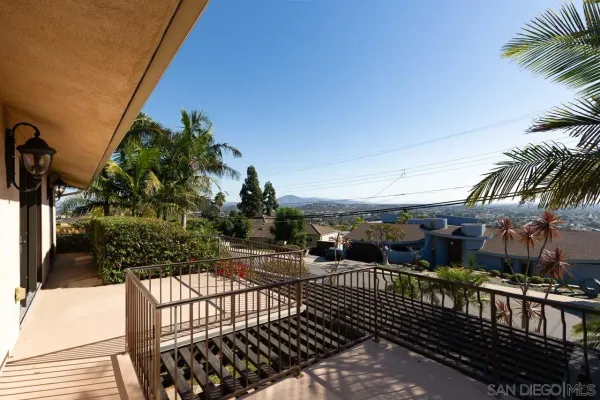 a view of a balcony with a potted plants