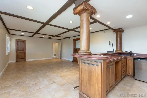 a view of living room with furniture and a ceiling fan