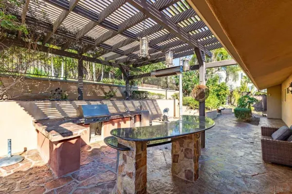 a view of a chairs and table in the patio