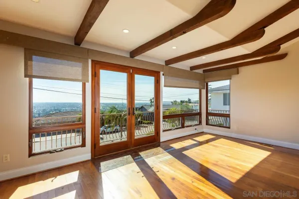a view of a room with a large window