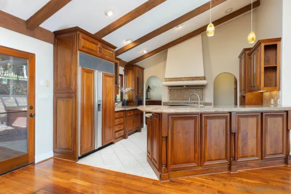 a view of living room kitchen and entryway