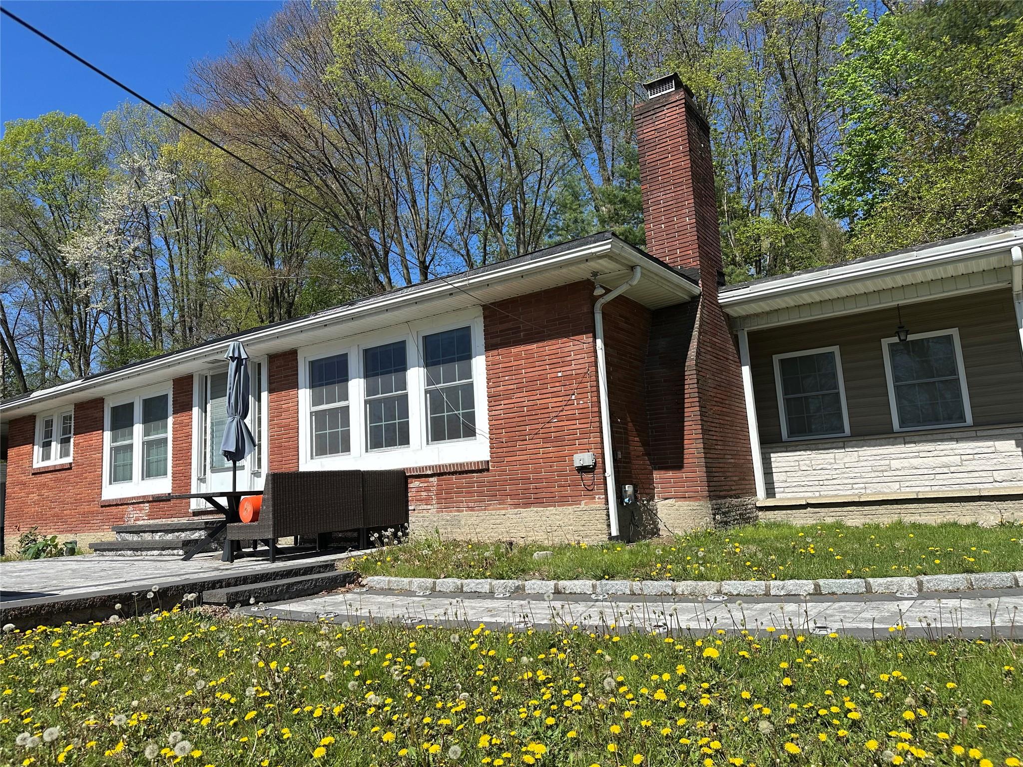 5035 Rte 9W Newburgh, NY 12550 - Photo 1 of 1 Single story home featuring brick siding and a chimney