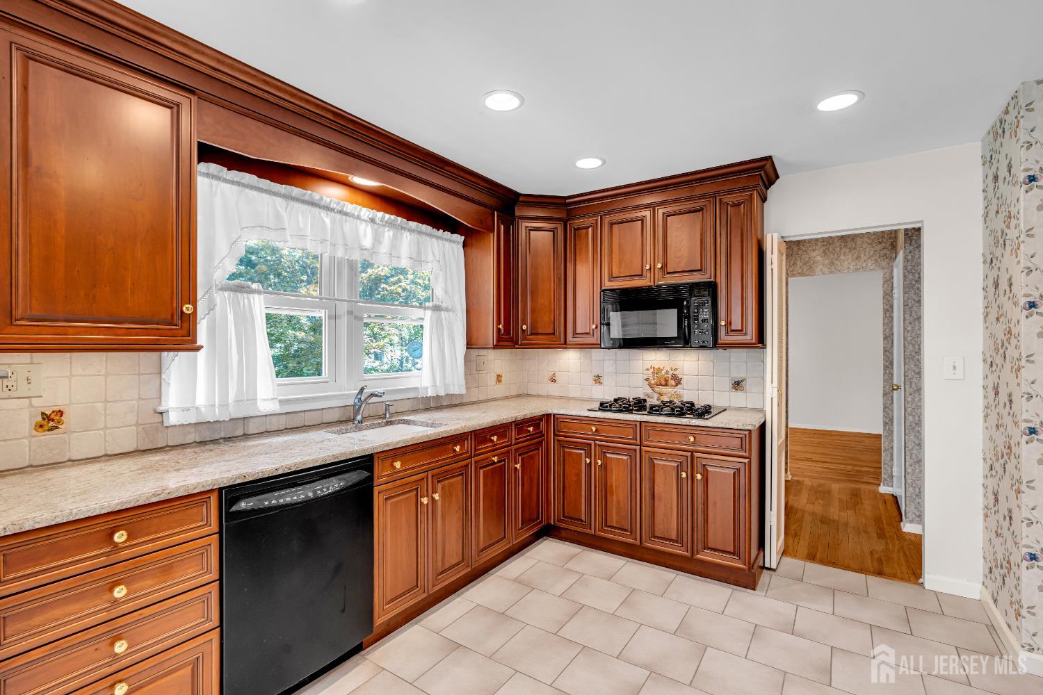 30 Daniel Drive Matawan, NJ 07747 - Photo 19 of 49 a kitchen with stainless steel appliances granite countertop a sink and a stove