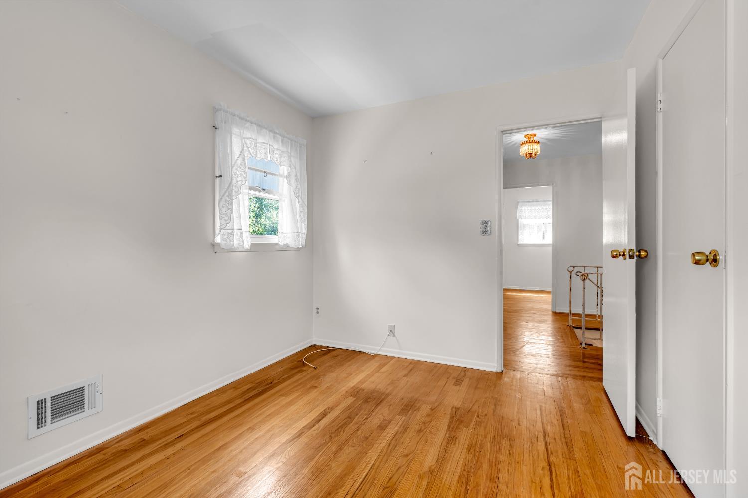 30 Daniel Drive Matawan, NJ 07747 - Photo 33 of 49 a view of empty room with wooden floor