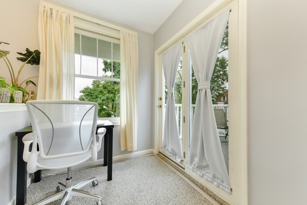 110 Maple Place, Unit 8 Dedham, MA 02026 - Photo 13 of 22 a view of a dining room with a table and chairs