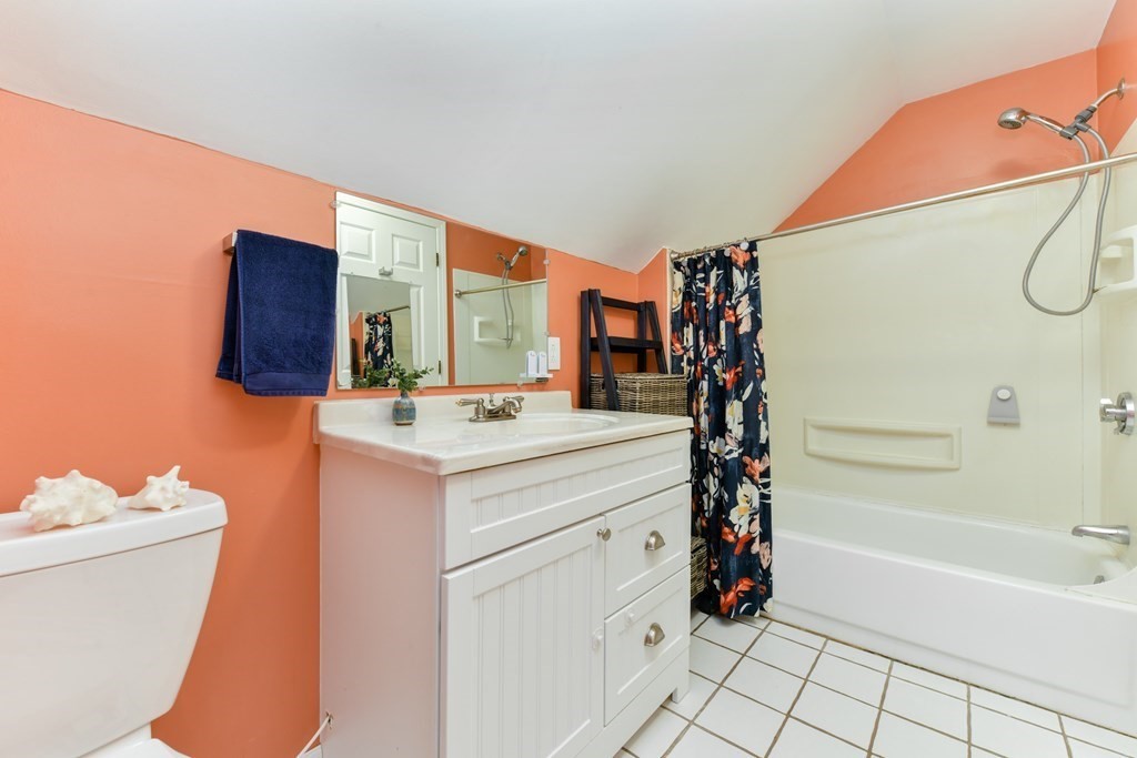 110 Maple Place, Unit 8 Dedham, MA 02026 - Photo 15 of 22 a bathroom with a sink toilet vanity and tub
