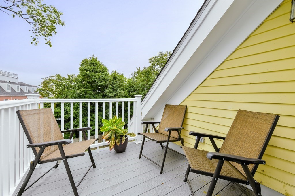 110 Maple Place, Unit 8 Dedham, MA 02026 - Photo 16 of 22 a view of chairs and table in patio
