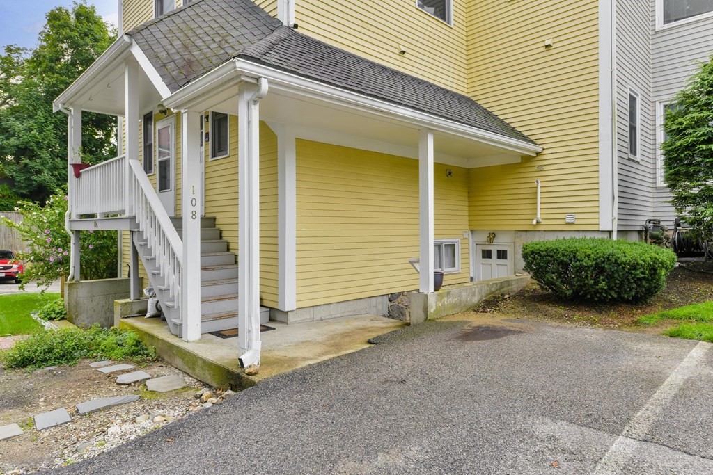 110 Maple Place, Unit 8 Dedham, MA 02026 - Photo 17 of 22 a view of a house with wooden fence