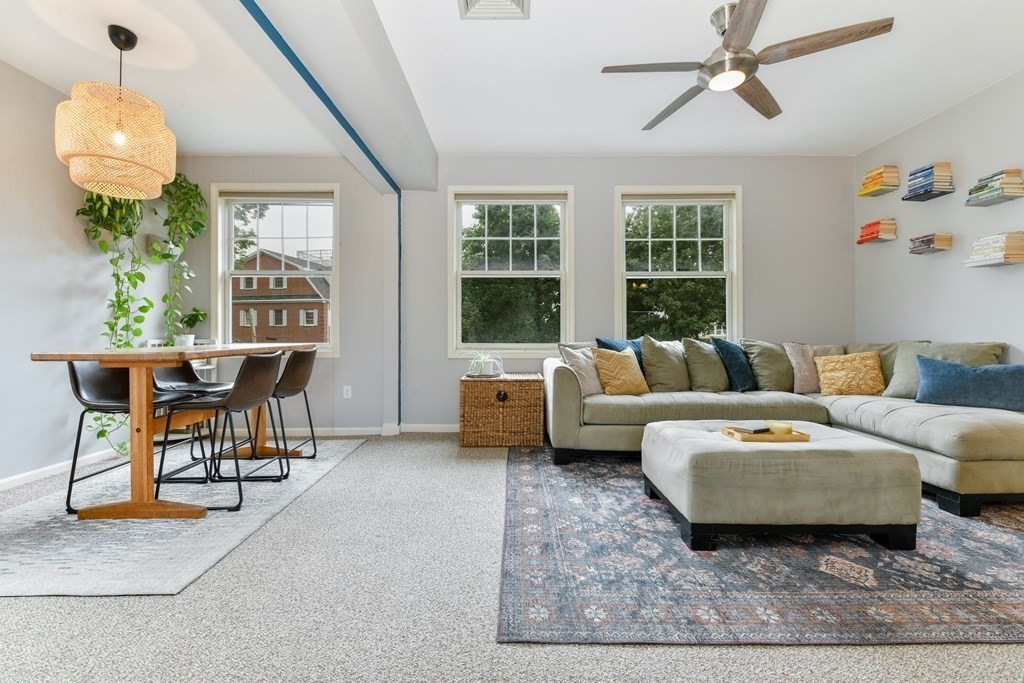 110 Maple Place, Unit 8 Dedham, MA 02026 - Photo 3 of 22 a living room with furniture and a chandelier