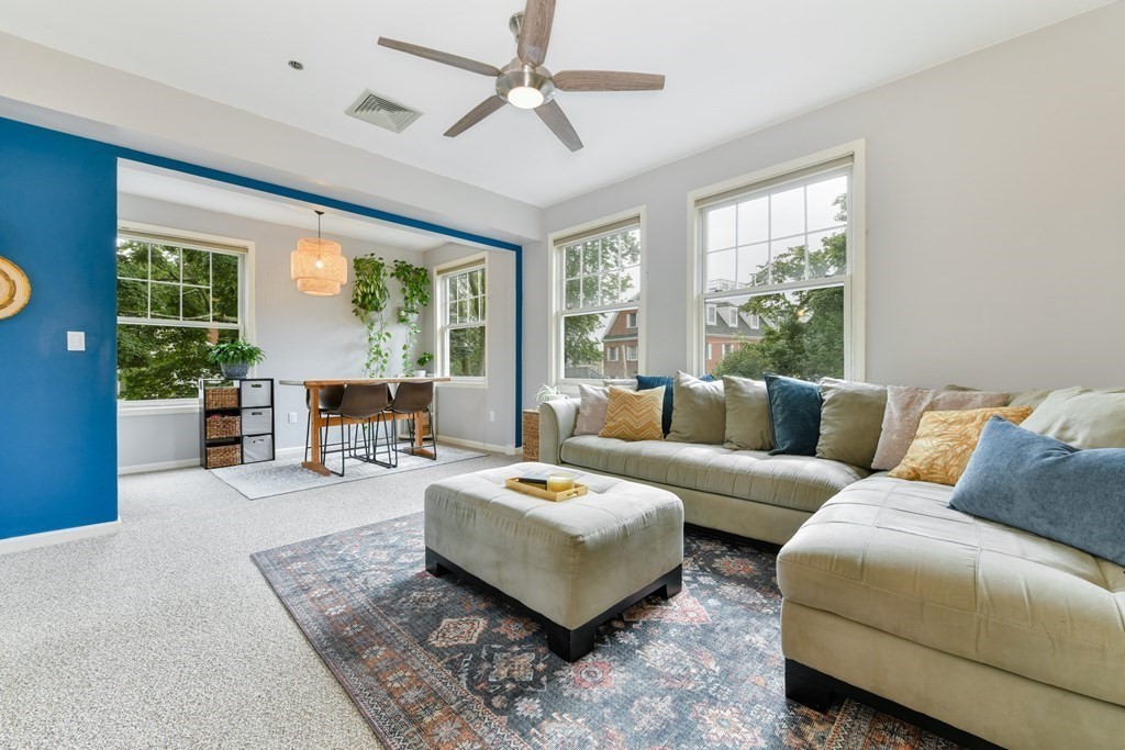 110 Maple Place, Unit 8 Dedham, MA 02026 - Photo 5 of 22 a living room with furniture and a large window