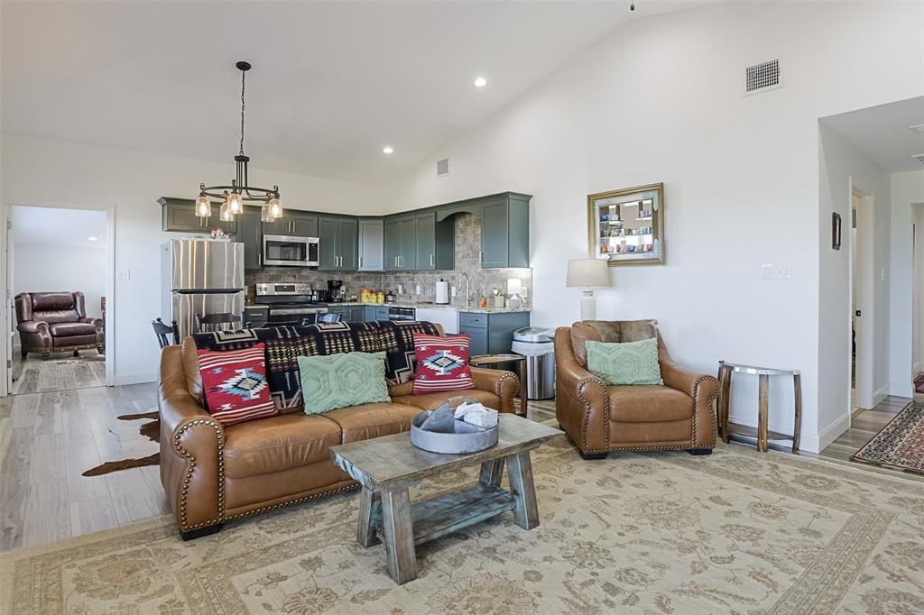 501 A Anderson Rnch Road Waxahachie, TX 75167 - Photo 16 of 36 a living room with furniture kitchen view and a chandelier