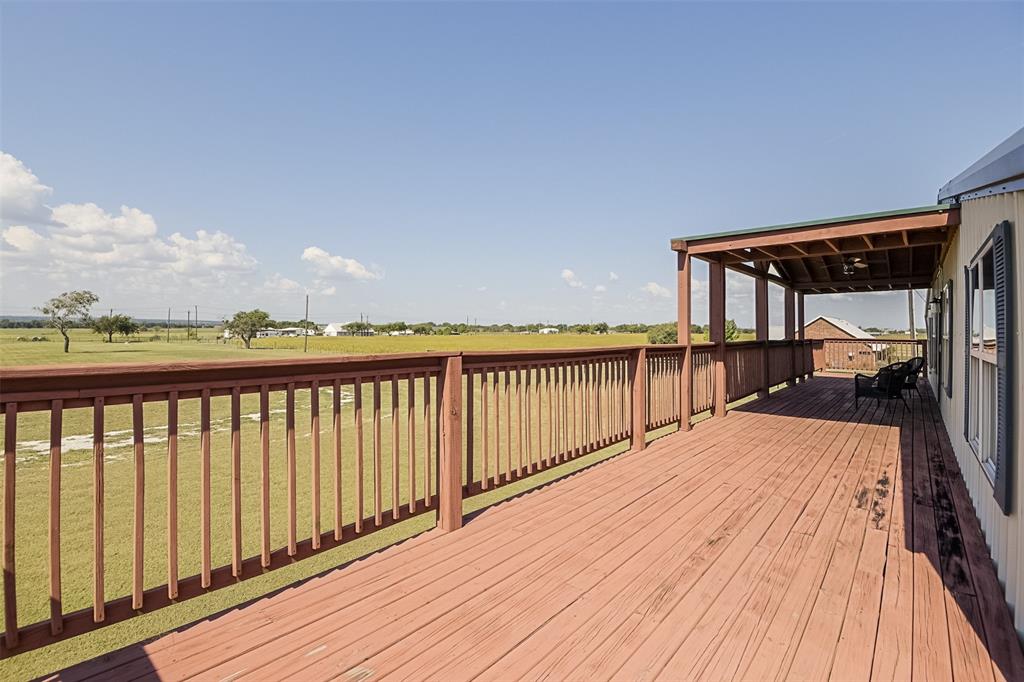 501 A Anderson Rnch Road Waxahachie, TX 75167 - Photo 31 of 36 a view of balcony with wooden floor and fence
