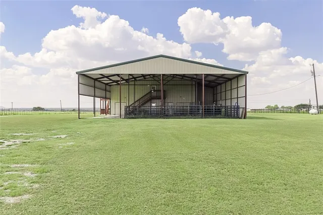 a front view of house with yard barbeque oven fire pit and outdoor seating