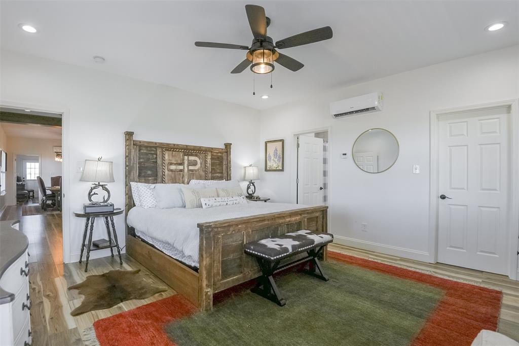 501 A Anderson Rnch Road Waxahachie, TX 75167 - Photo 10 of 36 a bed room with a bed mirror and a window