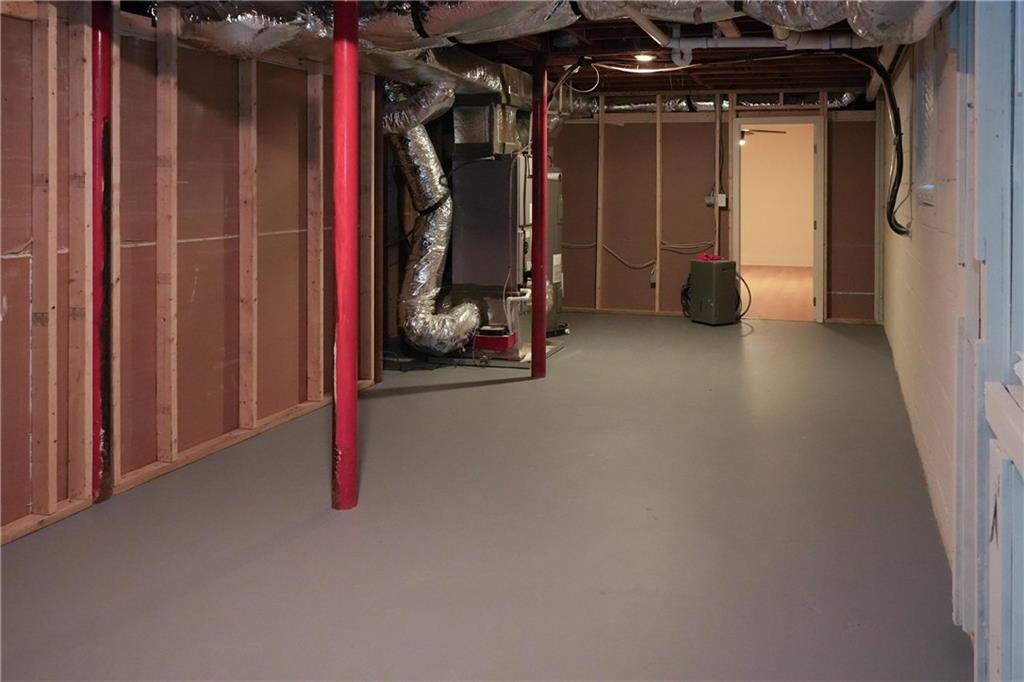 4747 Nelda Drive Austell, GA 30106 - Photo 18 of 23 a view of walk in closet with clothes and shoes