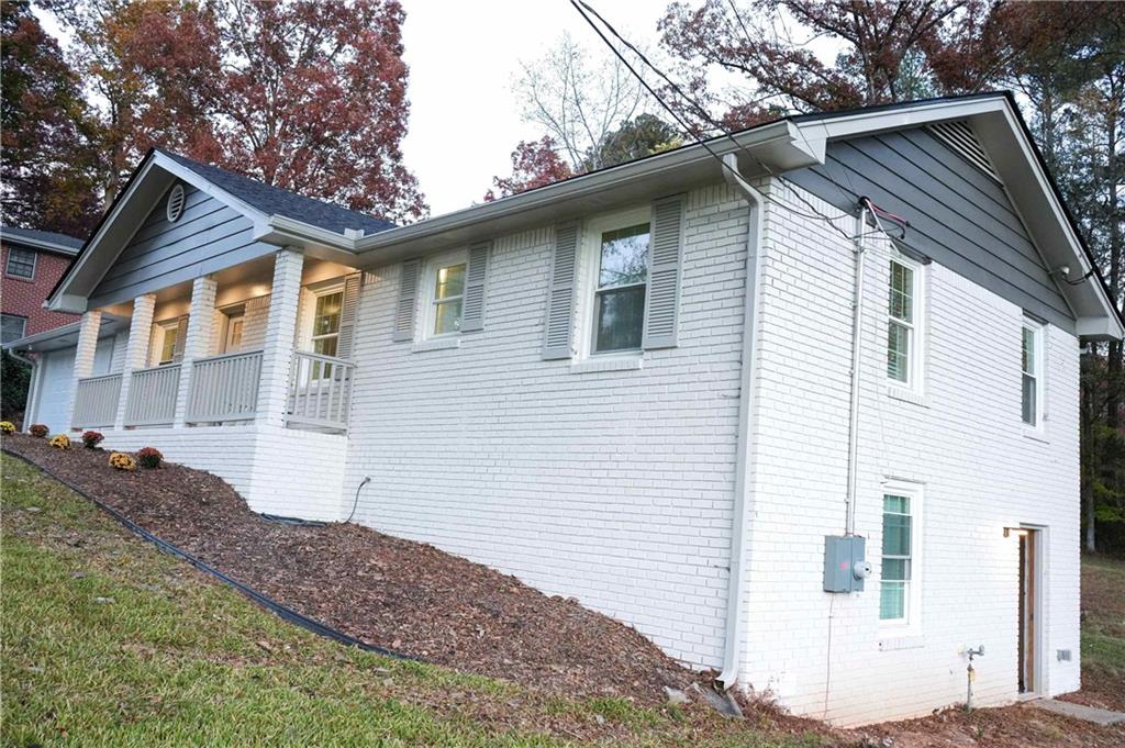 4747 Nelda Drive Austell, GA 30106 - Photo 22 of 23 a front view of a house with a yard