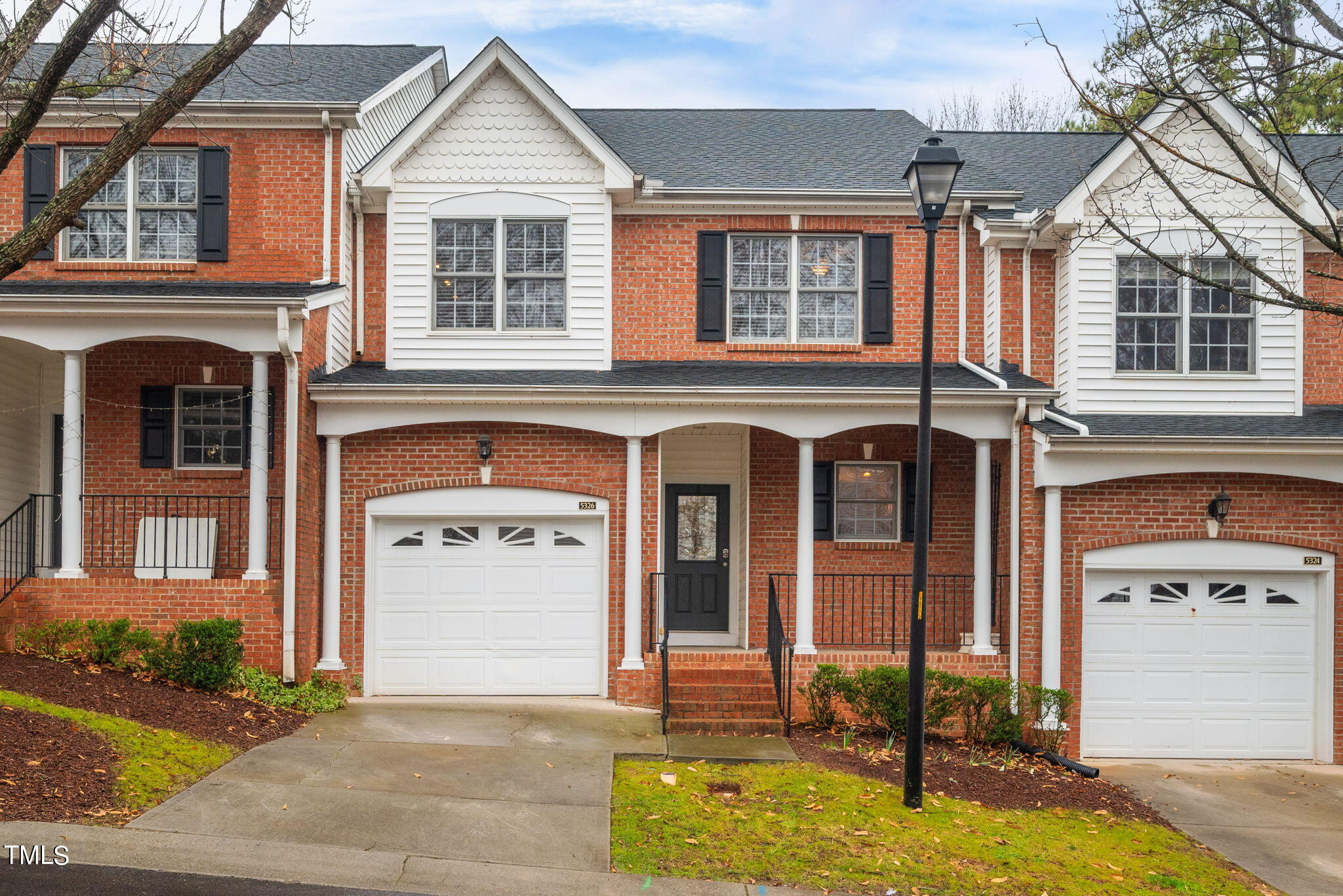5326 Goldenglow Way Raleigh, NC 27606 - Photo 3 of 41 a front view of a house with garden