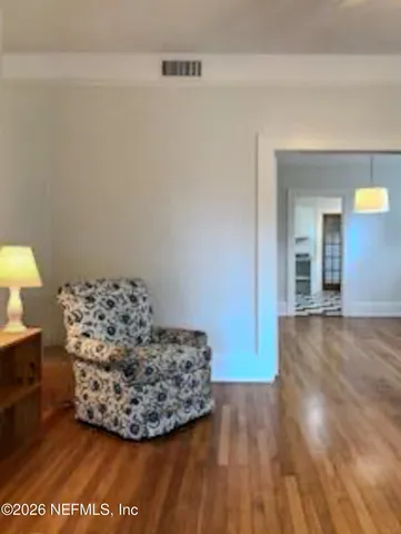 a view of a kitchen with an empty space and a sink