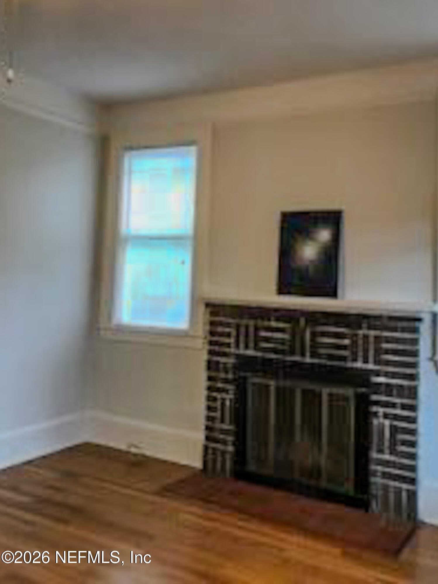 3664 Riverside Avenue Jacksonville, FL 32205 - Photo 5 of 19 a living room with furniture and a flat screen tv