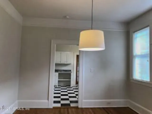 a room with a door and a rug