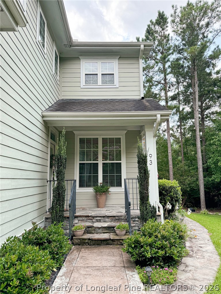 93 Falcon Ridge Drive Spring Lake, NC 28390 - Photo 2 of 50 a front view of a house with garden