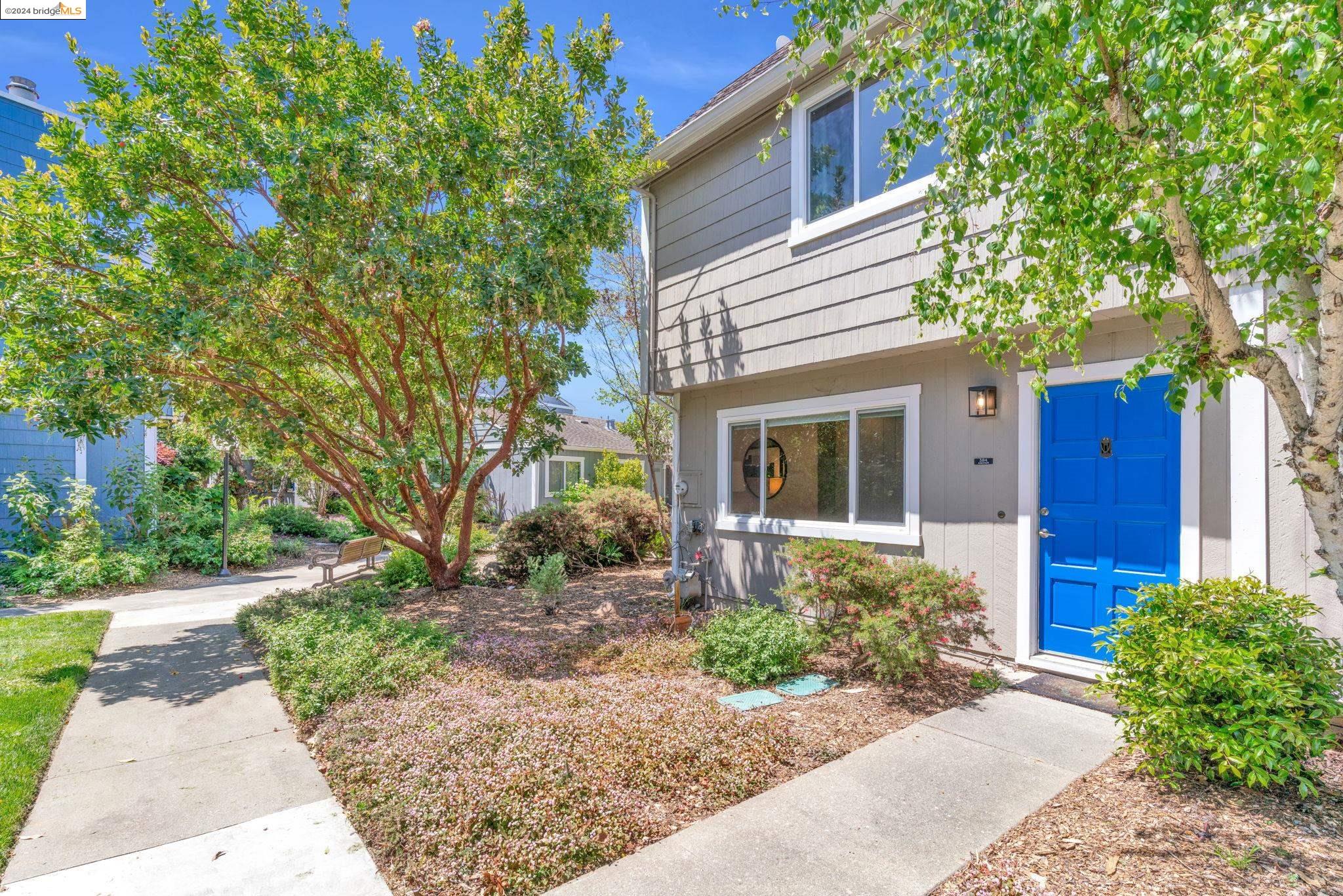 a front view of a house with garden