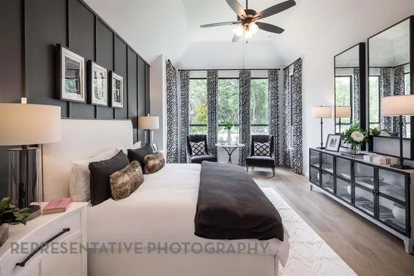 a living room with furniture fireplace and flat screen tv