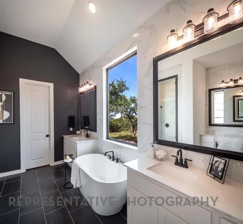 a spacious bathroom with a double vanity sink and a mirror