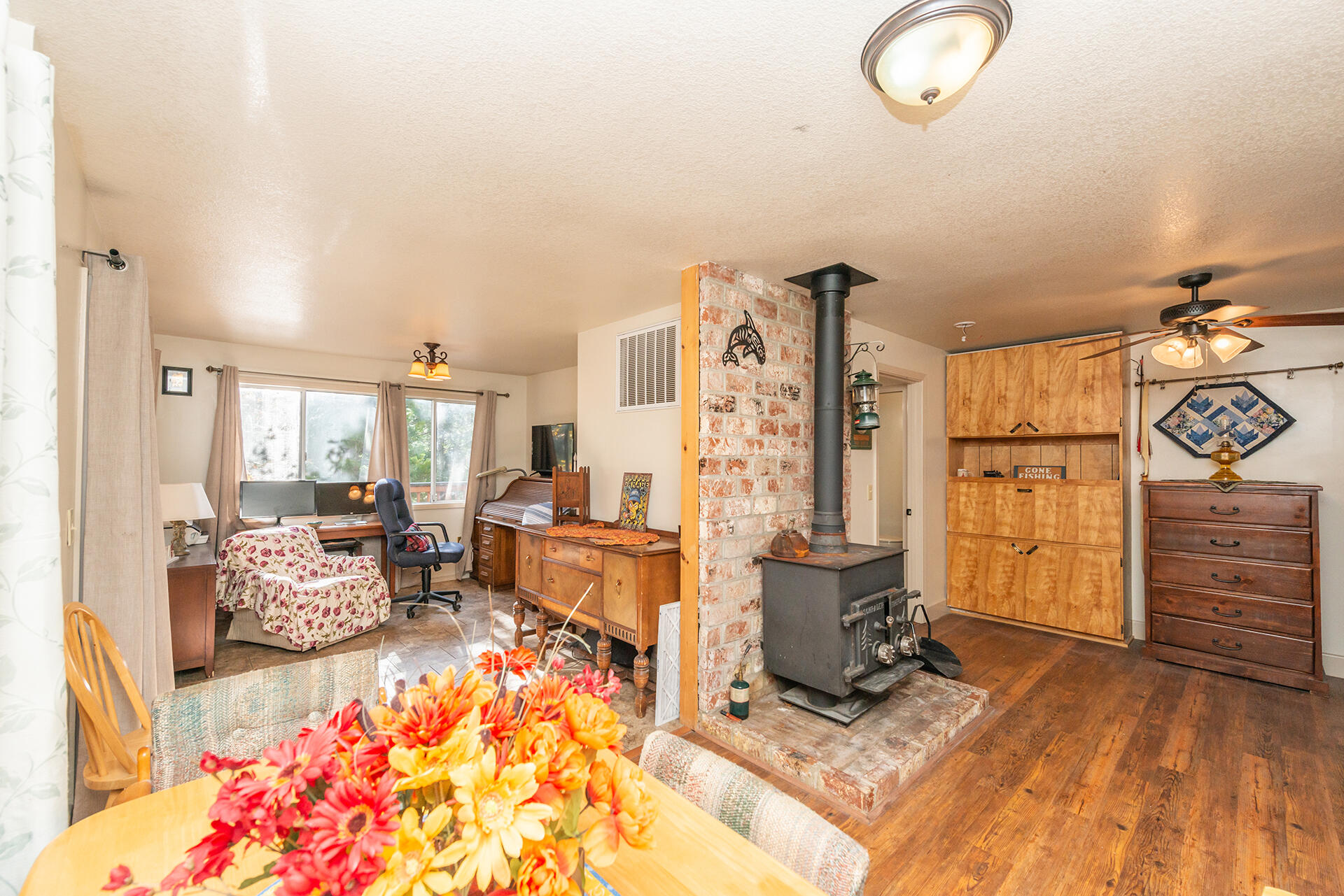 851 Mountain Aire Road Trinity Center, CA 96091 - Photo 43 of 54 a living room with furniture a rug and white walls