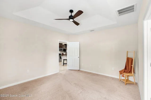 a view of room with ceiling fan